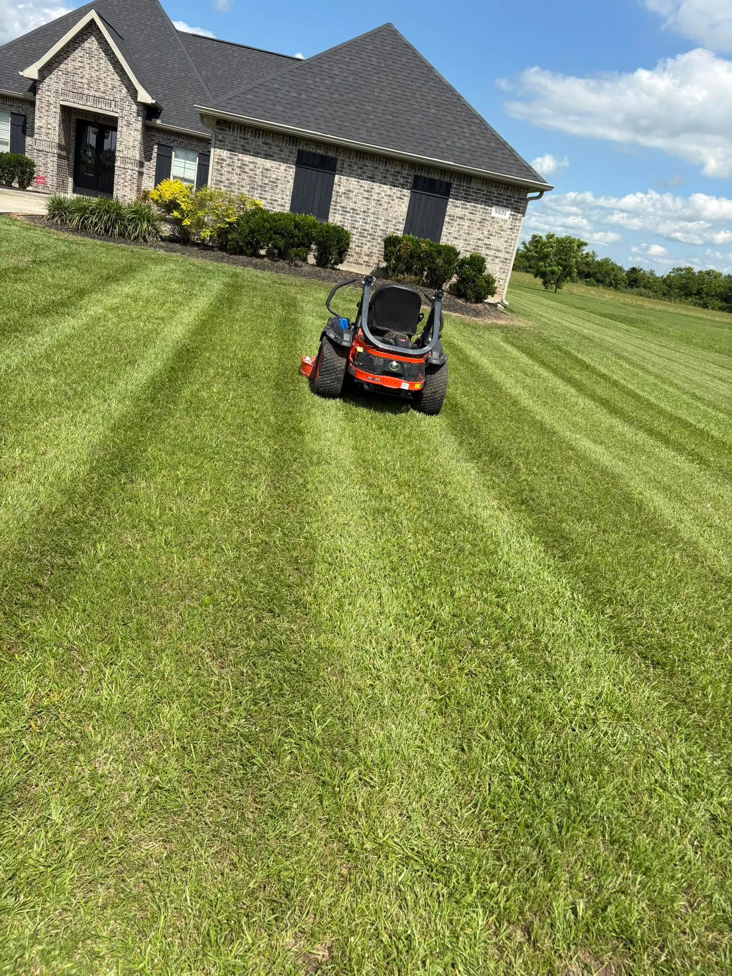 Lawn mower on a completed residential lawn